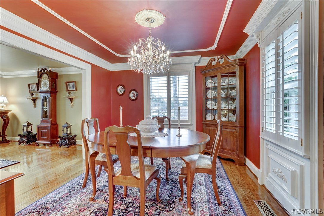 104 Tudor Road Colonial Heights, VA 23834 - Photo 14 of 50 a view of a dining room with furniture window and wooden floor