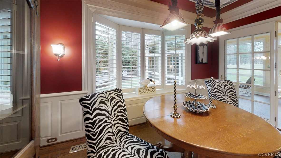104 Tudor Road Colonial Heights, VA 23834 - Photo 21 of 50 a view of a dining room with furniture wooden floor and chandelier
