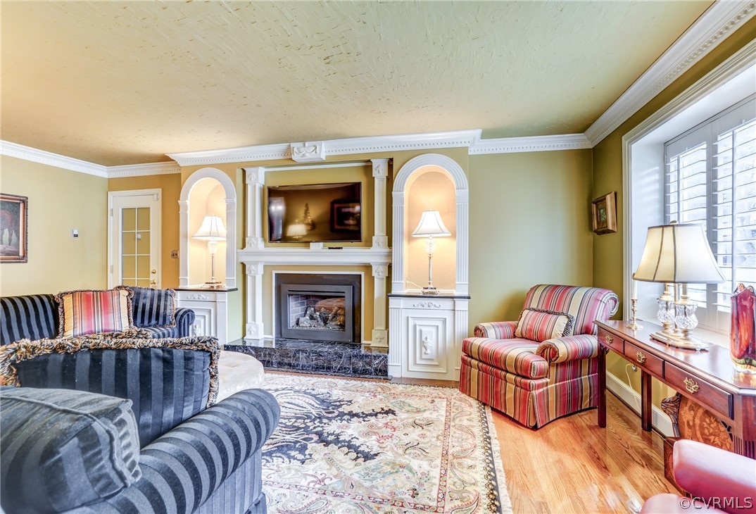 104 Tudor Road Colonial Heights, VA 23834 - Photo 23 of 50 a living room with furniture or couch and a fireplace
