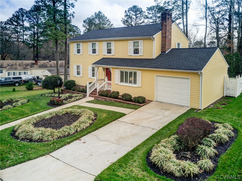 104 Tudor Road Colonial Heights, VA 23834 - Photo 3 of 50 a front view of a house with a yard