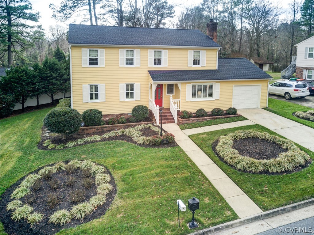 104 Tudor Road Colonial Heights, VA 23834 - Photo 4 of 50 a front view of a house with a yard