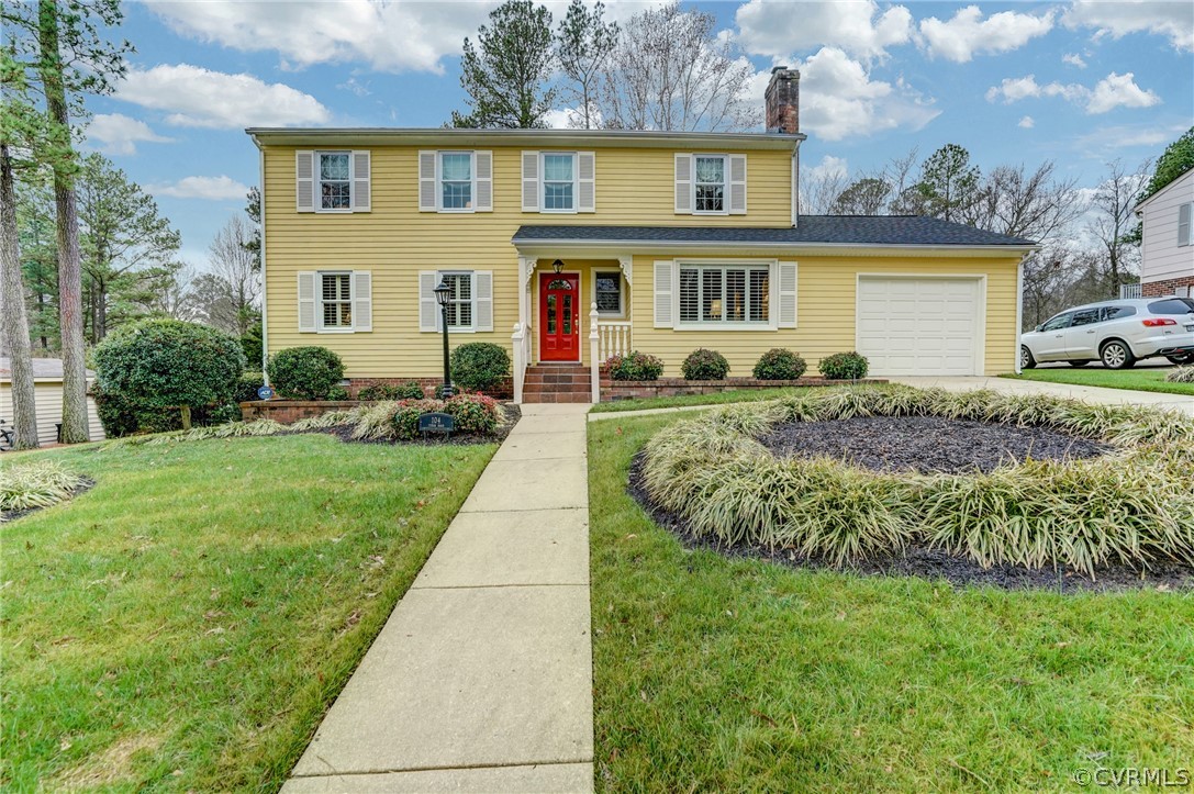 104 Tudor Road Colonial Heights, VA 23834 - Photo 5 of 50 a front view of a house with a yard