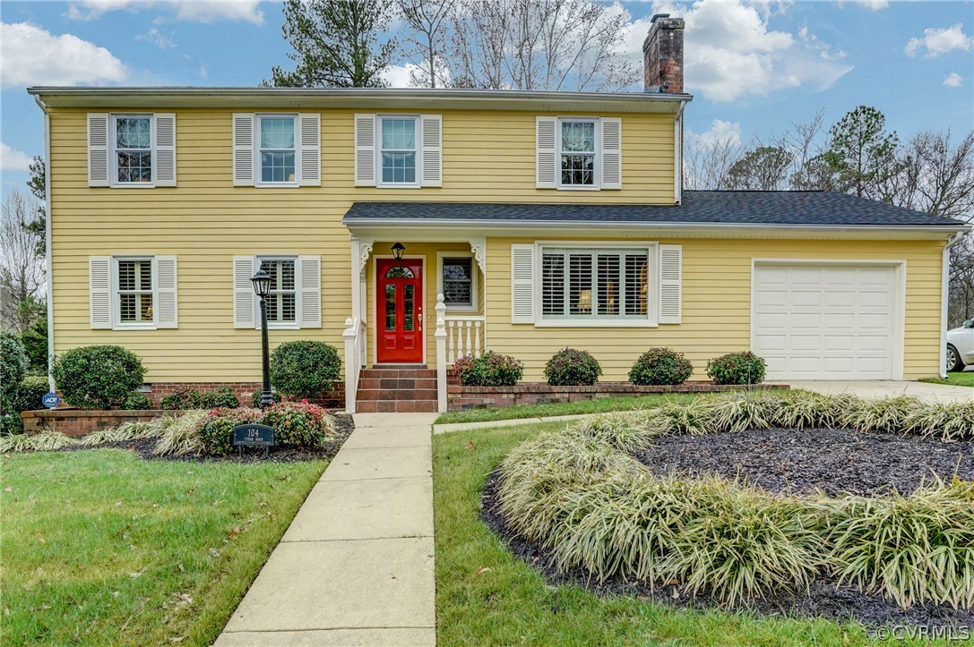 104 Tudor Road Colonial Heights, VA 23834 - Photo 6 of 50 a front view of a house with a yard