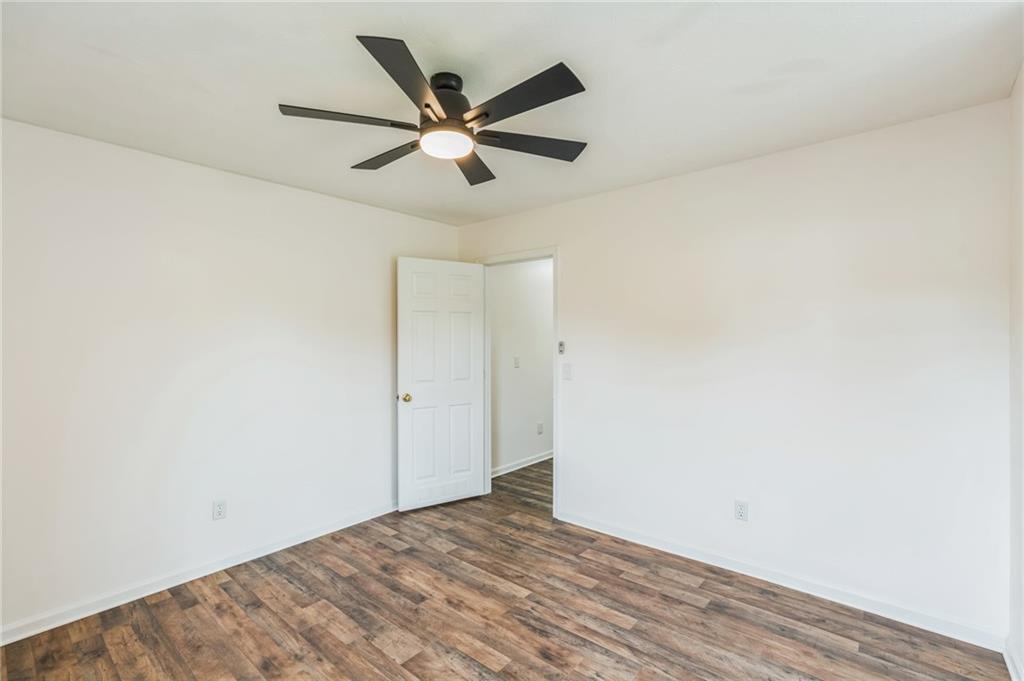 500 Coleman Mill Road Carrollton, GA 30116 - Photo 33 of 83 a view of a big room with wooden floor and closet in a room