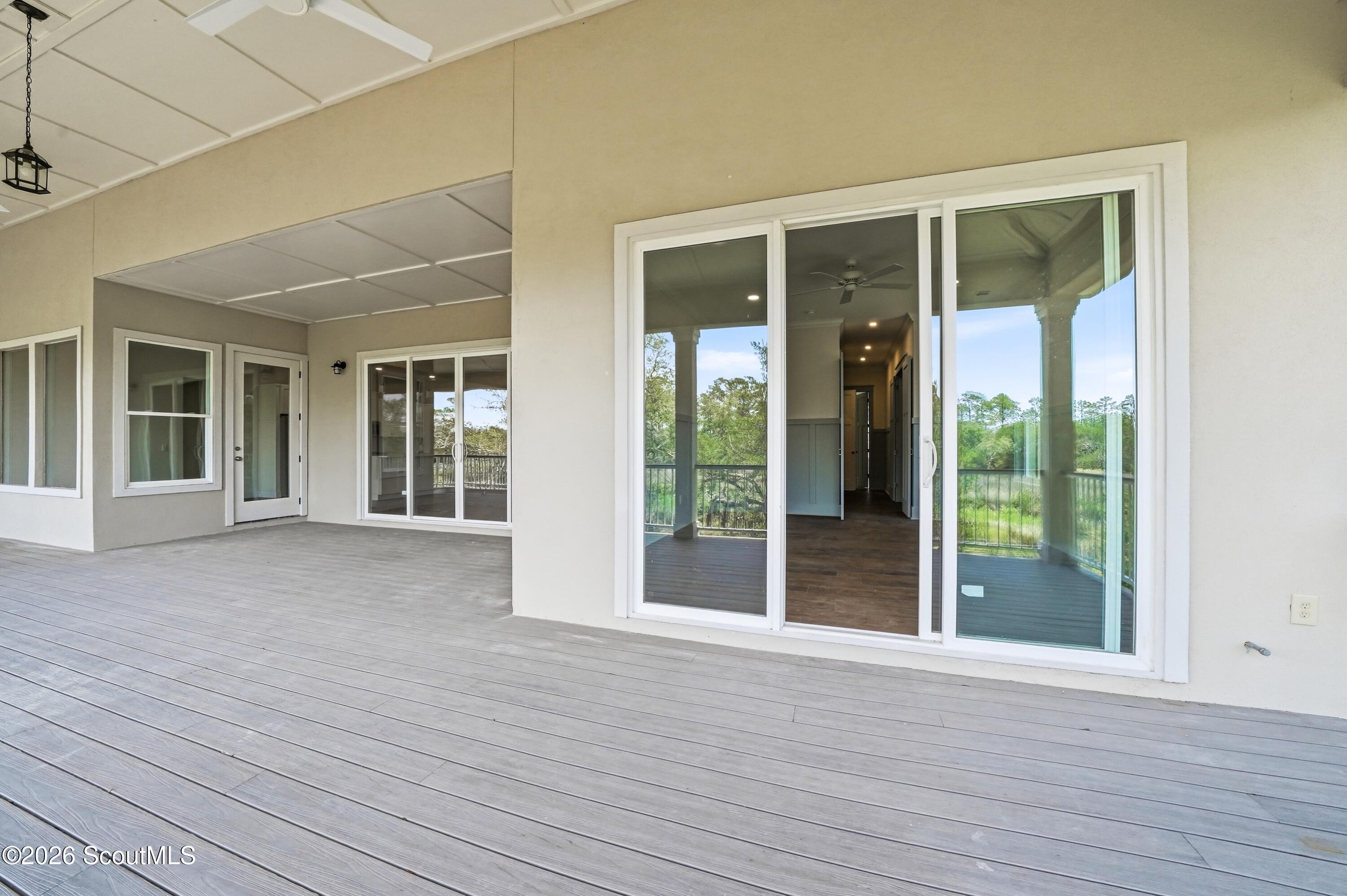 123 Rice Mill St. Simons Island, GA 31522 - Photo 22 of 83 Huge rear porch from primary bedroom and living room