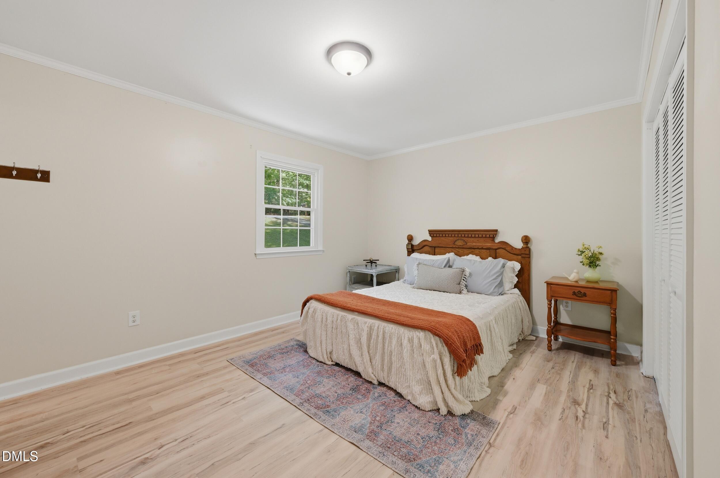 7811 Buckhorn Road Hillsborough, NC 27278 - Photo 21 of 47 a bedroom with a bed and a window