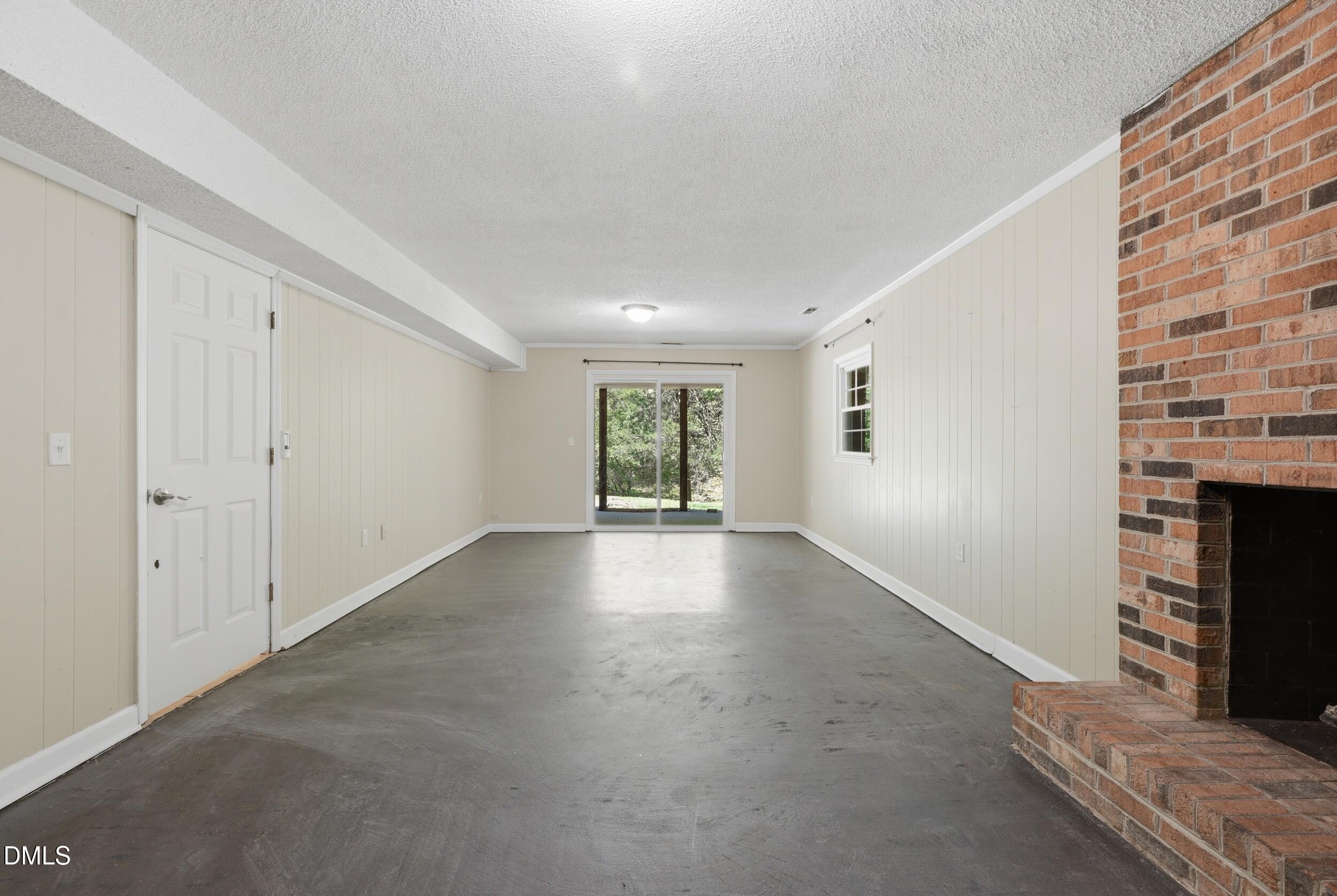 7811 Buckhorn Road Hillsborough, NC 27278 - Photo 25 of 47 a view of a livingroom with wooden floor and a fireplace