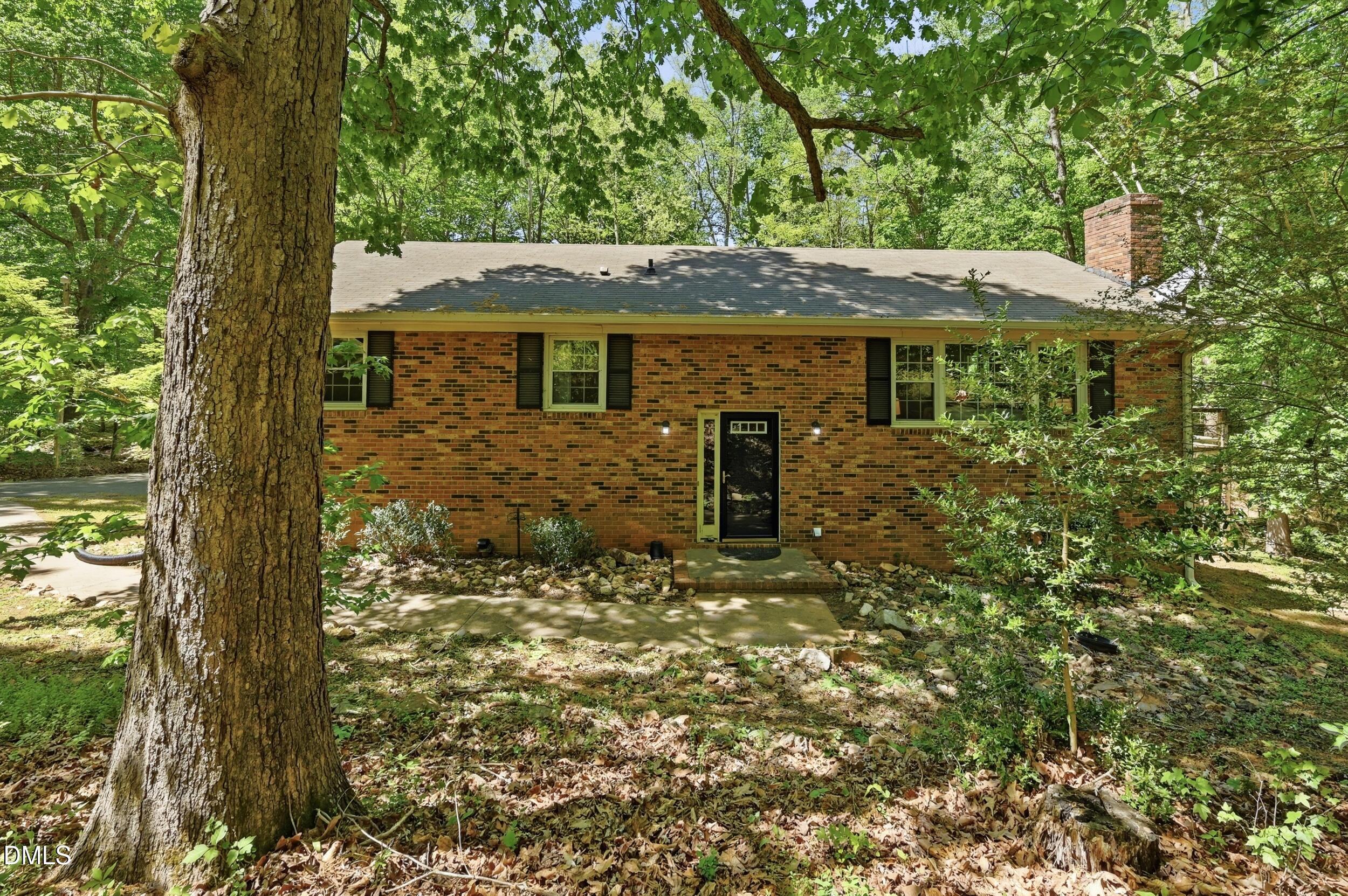 7811 Buckhorn Road Hillsborough, NC 27278 - Photo 3 of 47 a front view of a house with a yard