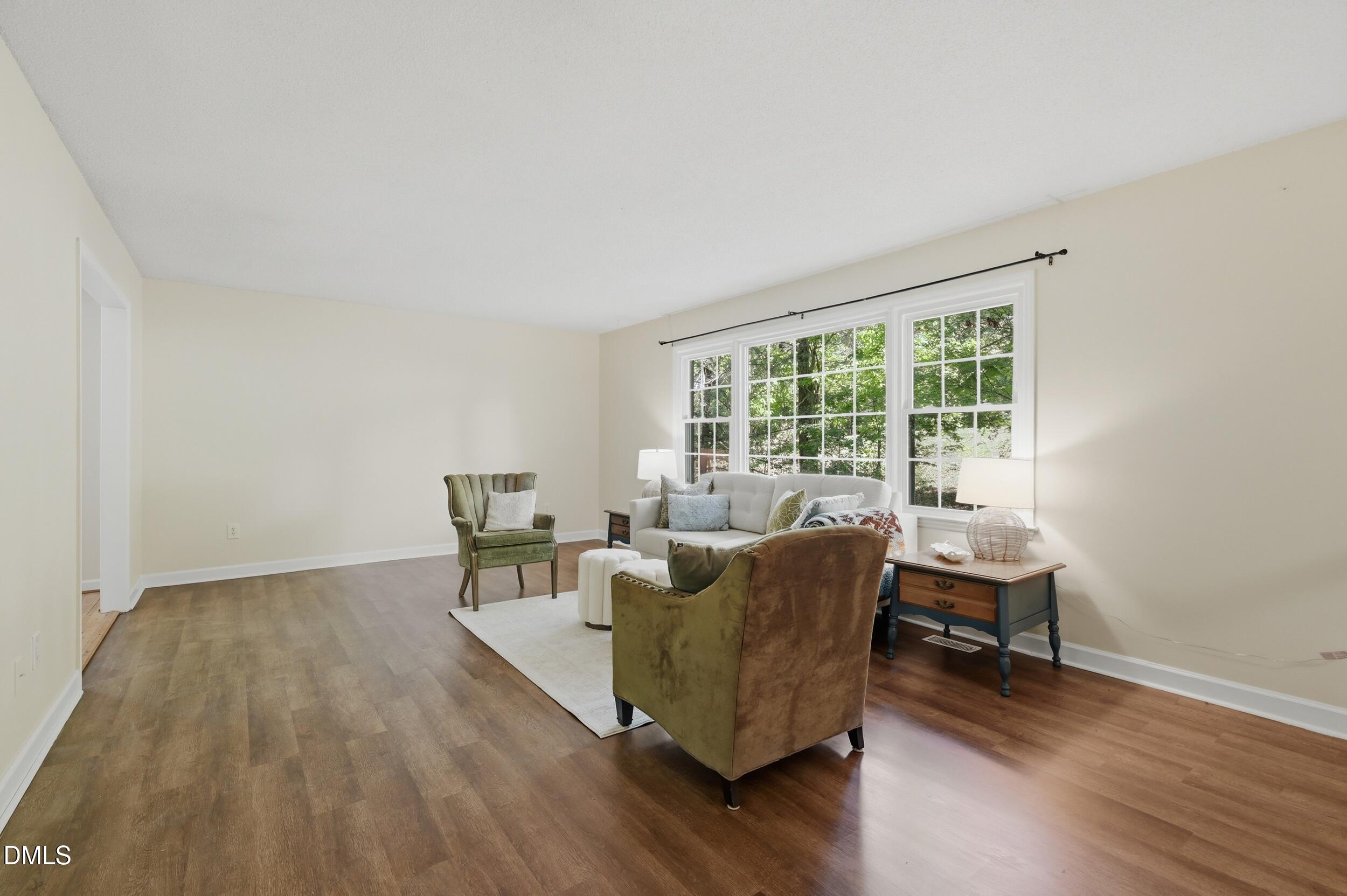 7811 Buckhorn Road Hillsborough, NC 27278 - Photo 6 of 47 a living room with furniture and a wooden floor