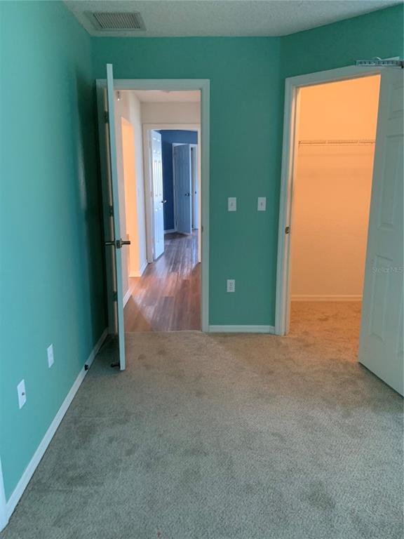 8340 Southwest 108th Pl Road Ocala, FL 34481 - Photo 17 of 32 Looking into hallway from guest bedroom #3