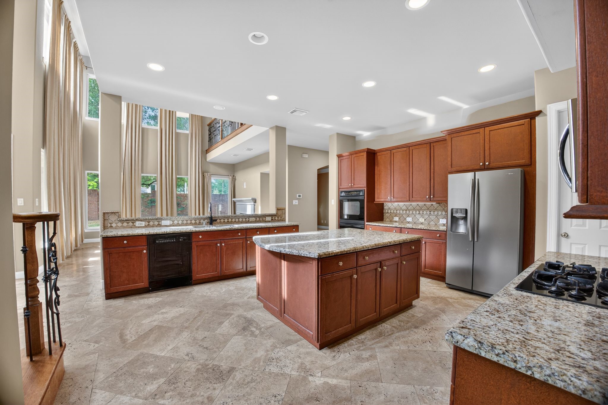 11511 Gallant Ridge Lane Houston, TX 77082 - Photo 16 of 49 a kitchen with stainless steel appliances granite countertop a stove a refrigerator a sink and dishwasher