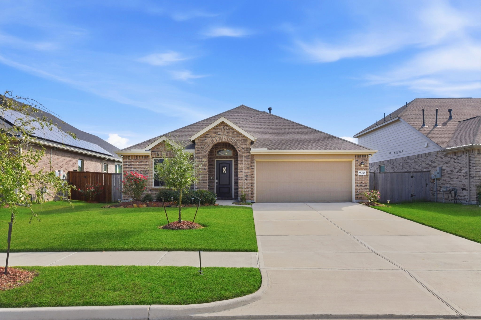 9010 Brazos Drive Baytown, TX 77521 - Photo 1 of 37 a front view of a house with a yard and garage