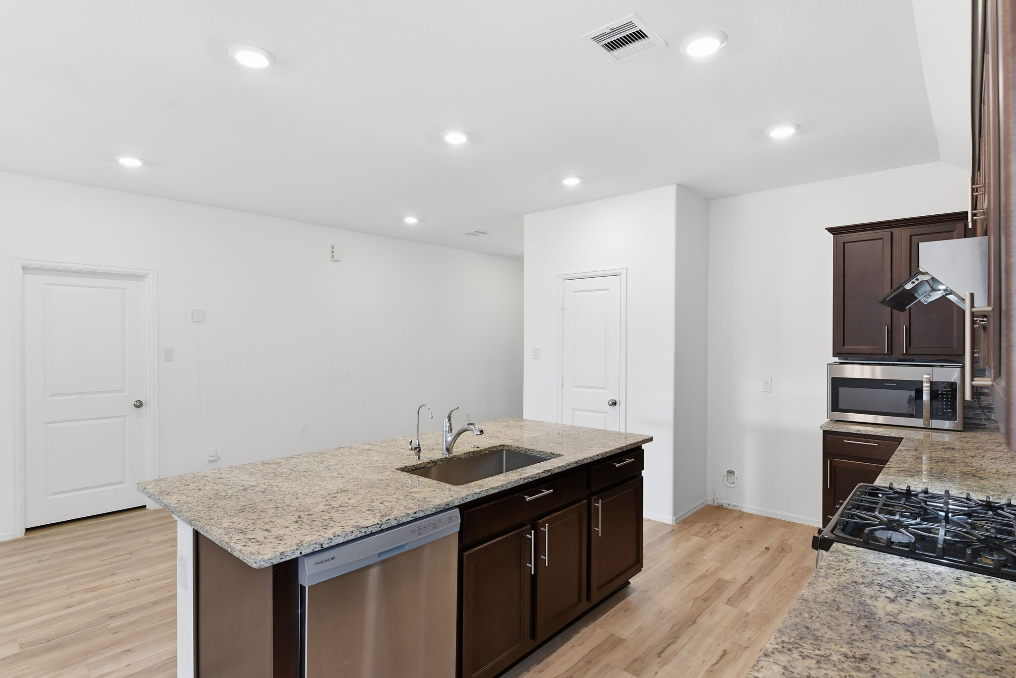 9010 Brazos Drive Baytown, TX 77521 - Photo 12 of 37 a kitchen with a sink stove and cabinets