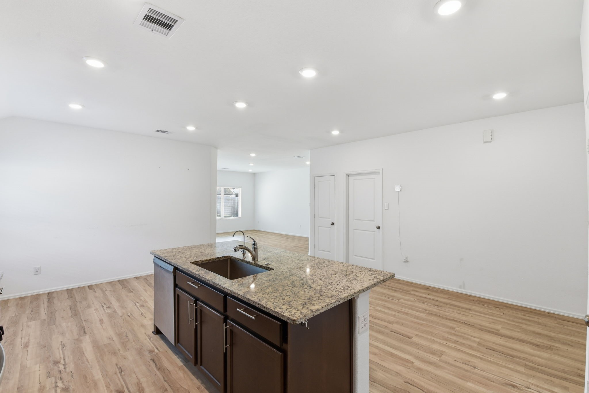 9010 Brazos Drive Baytown, TX 77521 - Photo 14 of 37 a kitchen with a sink cabinets and wooden floor