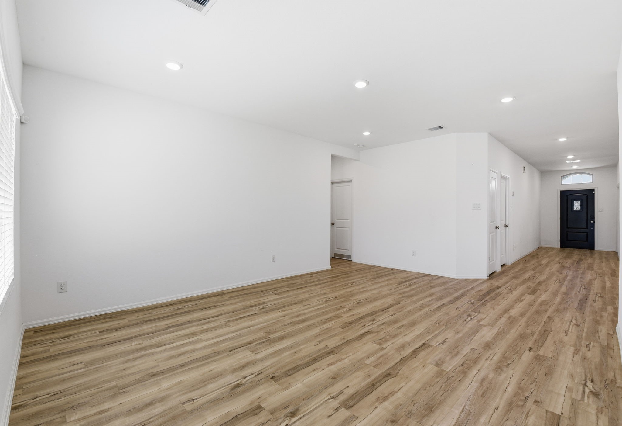 9010 Brazos Drive Baytown, TX 77521 - Photo 17 of 37 a view of an empty room with wooden floor