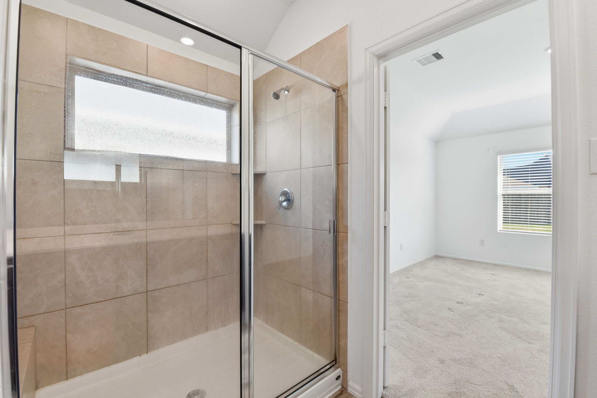 9010 Brazos Drive Baytown, TX 77521 - Photo 24 of 37 a bathroom with a glass shower door