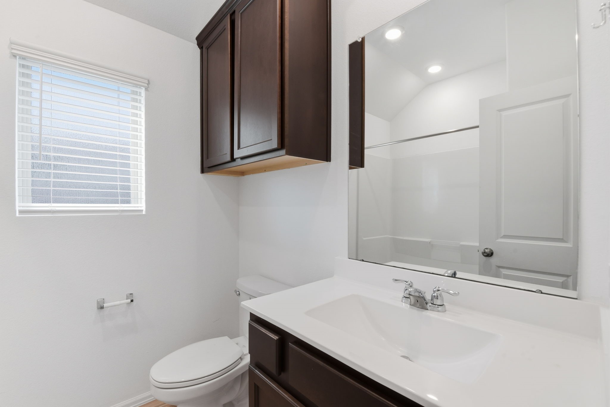 9010 Brazos Drive Baytown, TX 77521 - Photo 28 of 37 a bathroom with a sink toilet a mirror and shower