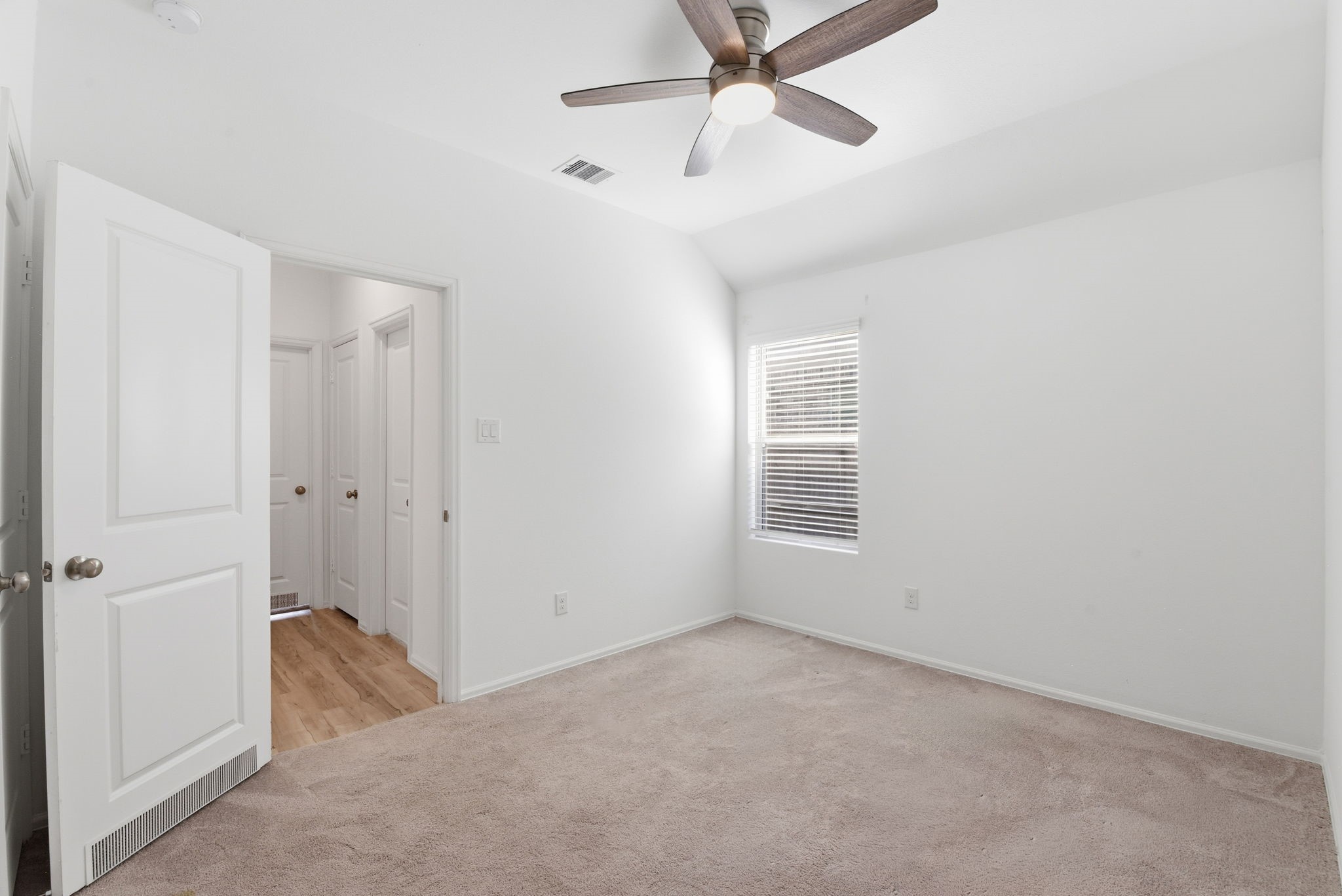 9010 Brazos Drive Baytown, TX 77521 - Photo 31 of 37 a view of a room with a ceiling fan and a window