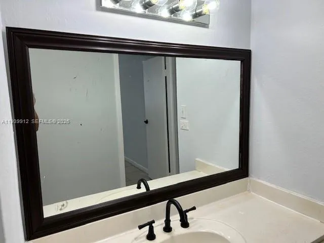 a bathroom with a bathtub and a sink