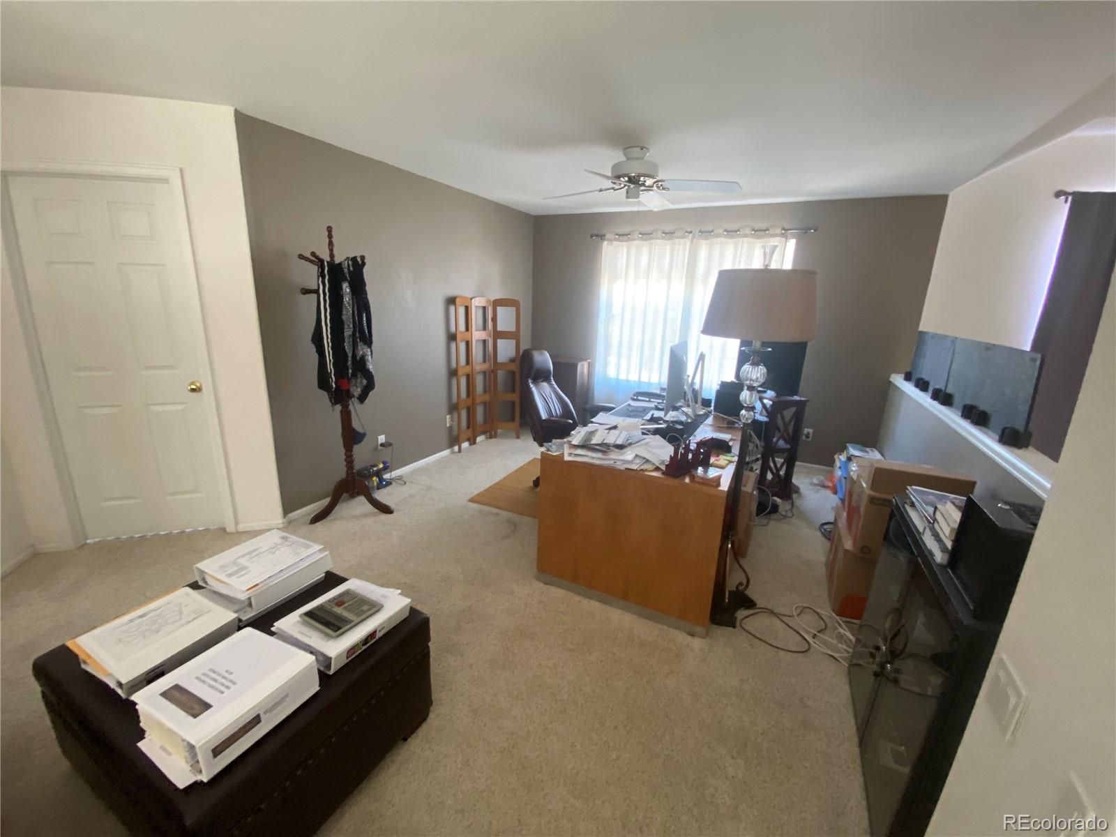 7100 Cerney Circle Castle Pines, CO 80108 - Photo 13 of 22 a living room with furniture and a window