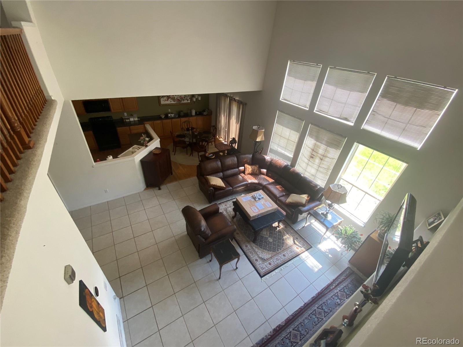 7100 Cerney Circle Castle Pines, CO 80108 - Photo 15 of 22 a view of living room with furniture and a flat screen tv