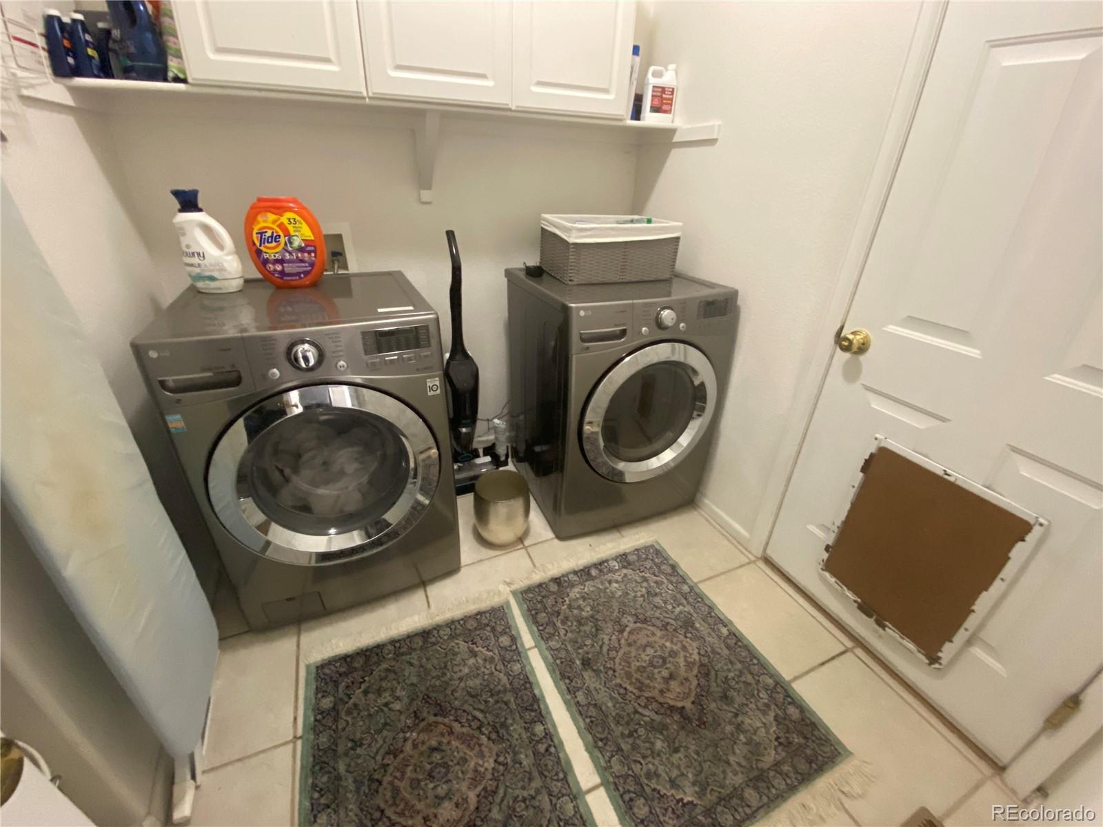 7100 Cerney Circle Castle Pines, CO 80108 - Photo 20 of 22 a utility room with dryer and washer