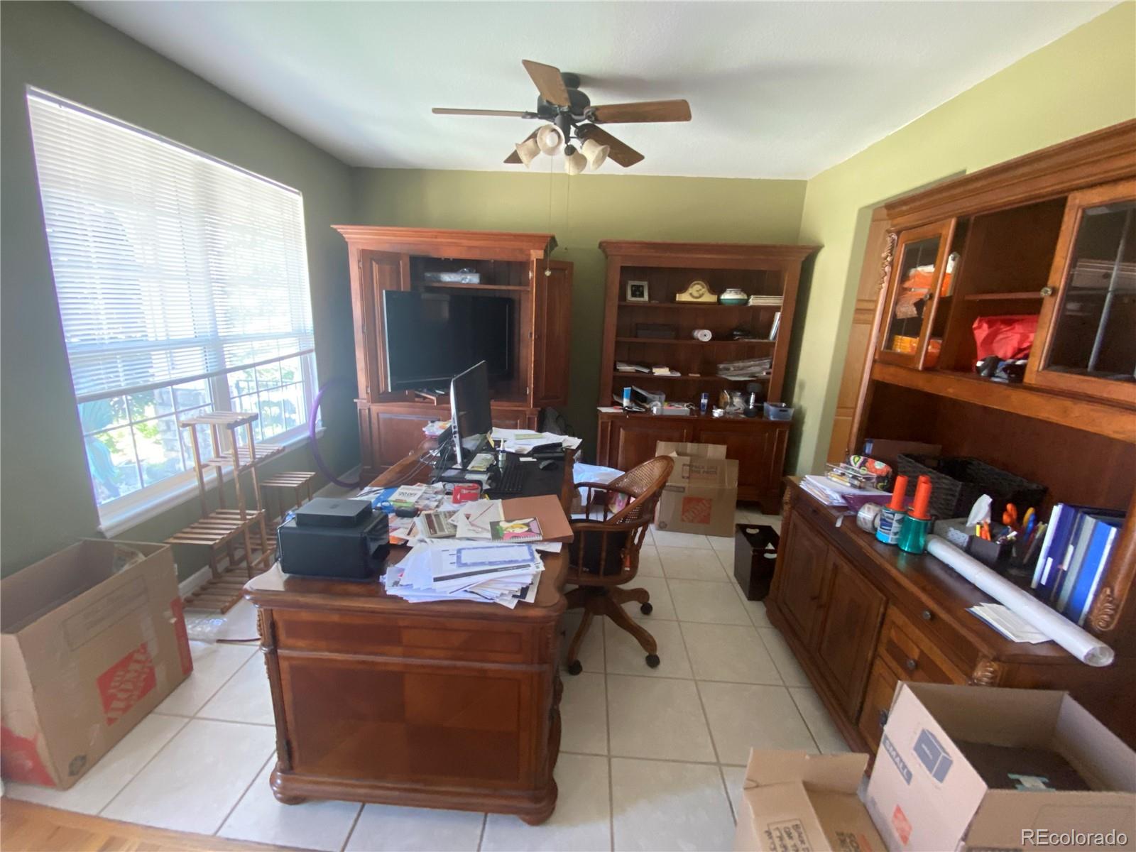 7100 Cerney Circle Castle Pines, CO 80108 - Photo 2 of 22 a living room with furniture and a flat screen tv