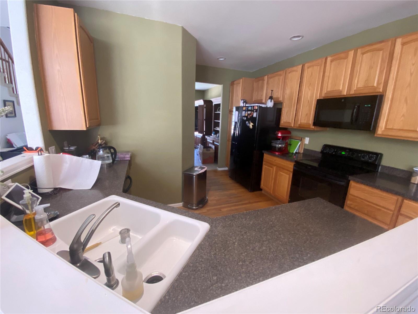 7100 Cerney Circle Castle Pines, CO 80108 - Photo 7 of 22 a living room with furniture and a flat screen tv