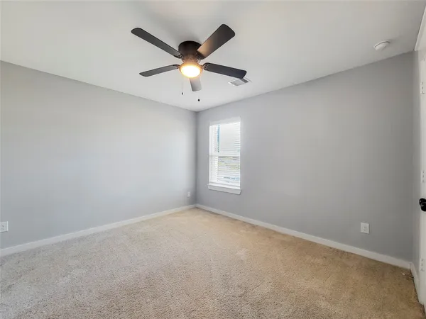 a view of a livingroom with a ceiling fan