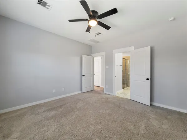 a bathroom with a shower and a sink