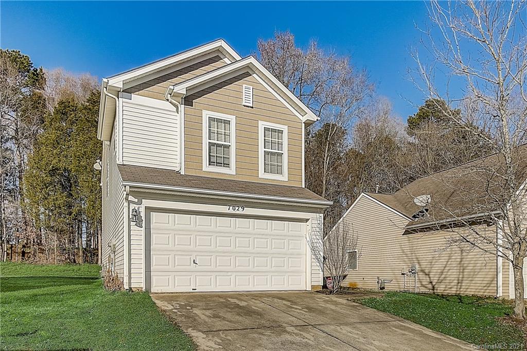 7029 Sunman Road Charlotte, NC 28216 - Photo 2 of 33 a view of a house with a yard