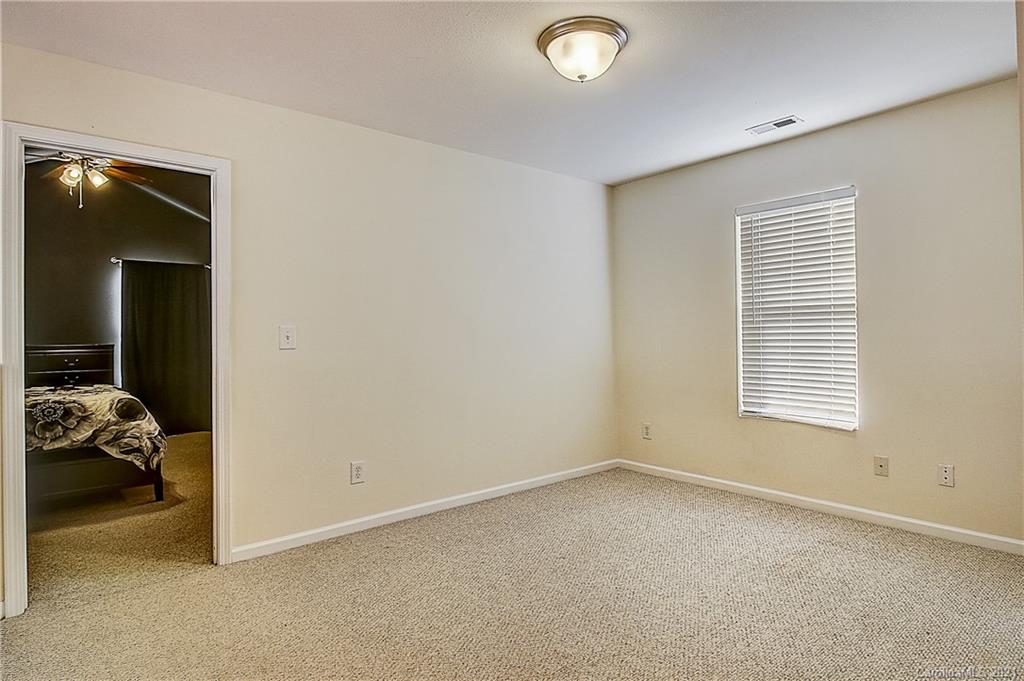 7029 Sunman Road Charlotte, NC 28216 - Photo 19 of 33 a view of livingroom with furniture and windows