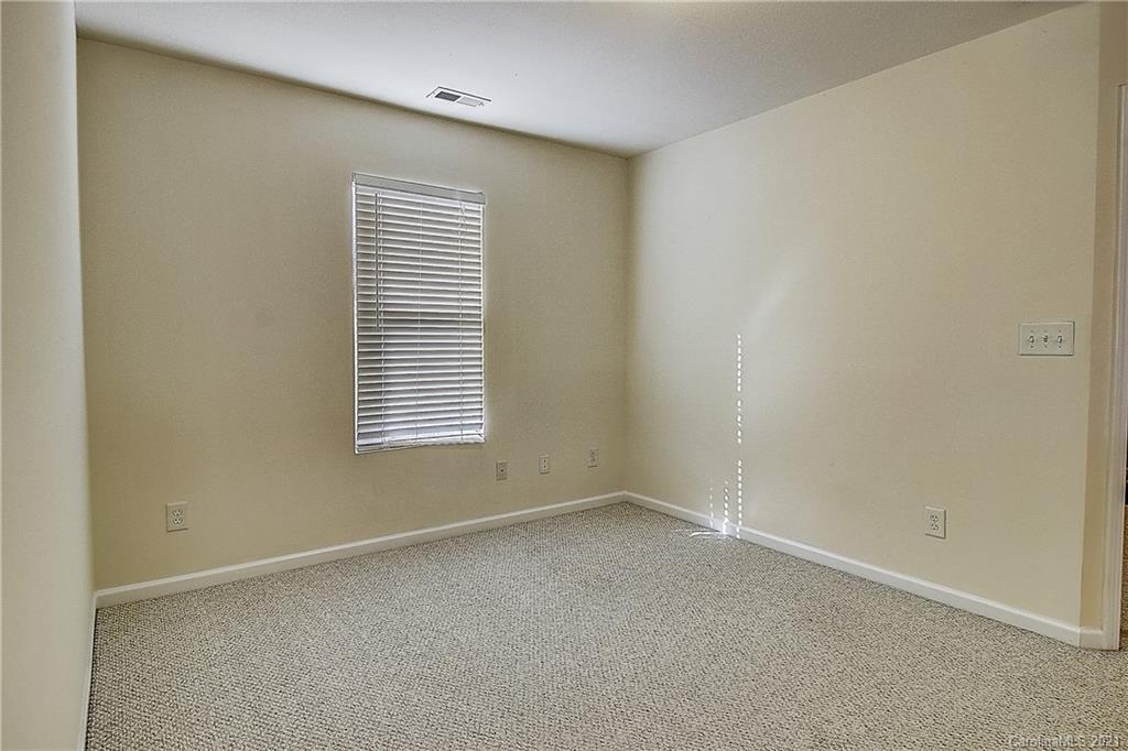 7029 Sunman Road Charlotte, NC 28216 - Photo 20 of 33 a view of an empty room with a window