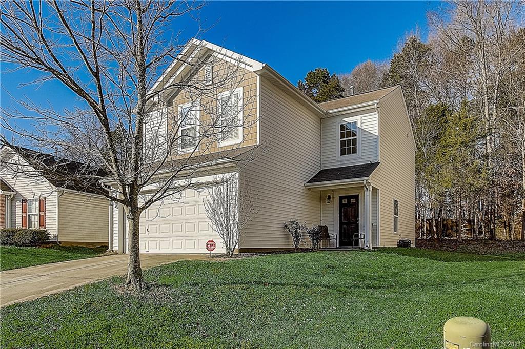 7029 Sunman Road Charlotte, NC 28216 - Photo 3 of 33 a front view of a house with a yard