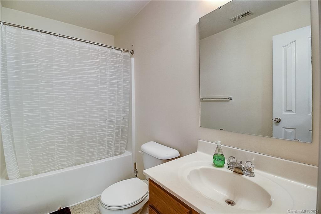 7029 Sunman Road Charlotte, NC 28216 - Photo 22 of 33 a bathroom with a sink toilet and shower