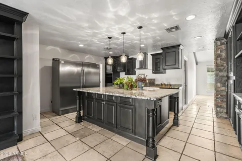 a kitchen with kitchen island granite countertop lots of counter top space