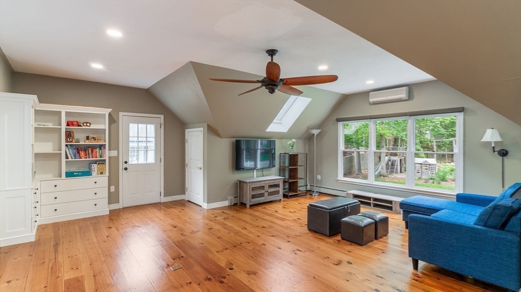 142 Baker Street Walpole, MA 02081 - Photo 15 of 42 a living room with furniture wooden floor and a window