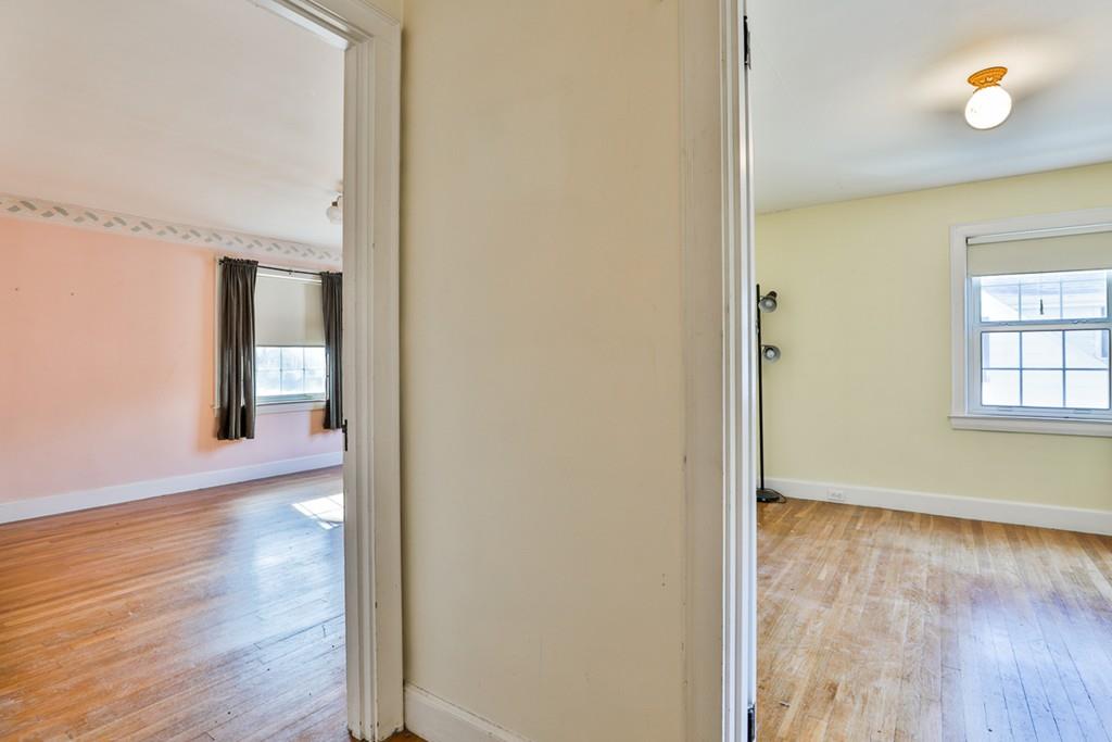554 Brook Road Milton, MA 02186 - Photo 17 of 22 a view of hallway with wooden floor