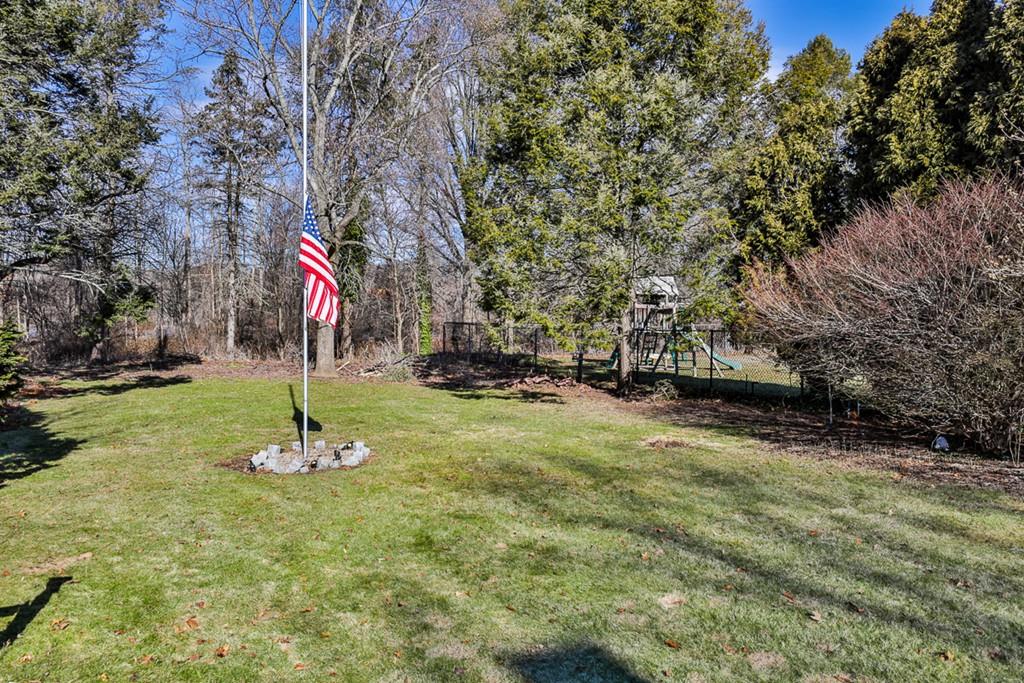554 Brook Road Milton, MA 02186 - Photo 21 of 22 a front view of a house with a yard
