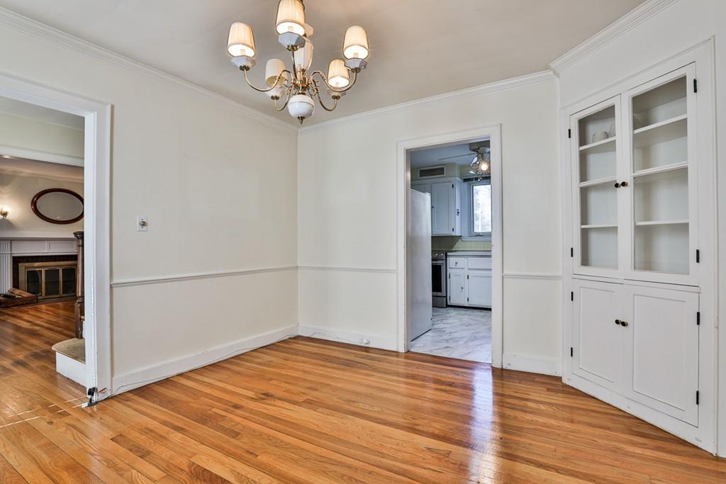554 Brook Road Milton, MA 02186 - Photo 8 of 22 a view of empty room with wooden floor and fan