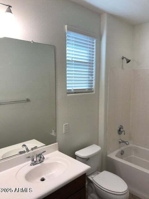 3838 East Cat Balue Drive Phoenix, AZ 85050 - Photo 16 of 22 a bathroom with a sink a toilet and shower
