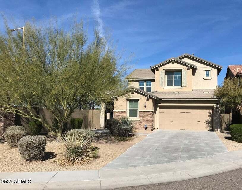 3838 East Cat Balue Drive Phoenix, AZ 85050 - Photo 3 of 22 a front view of a house with a yard and garage