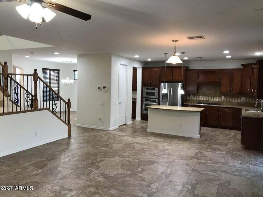 3838 East Cat Balue Drive Phoenix, AZ 85050 - Photo 6 of 22 a view of kitchen with cabinets and refrigerator