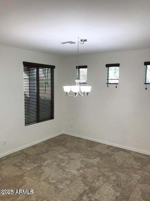 3838 East Cat Balue Drive Phoenix, AZ 85050 - Photo 7 of 22 an empty room with windows