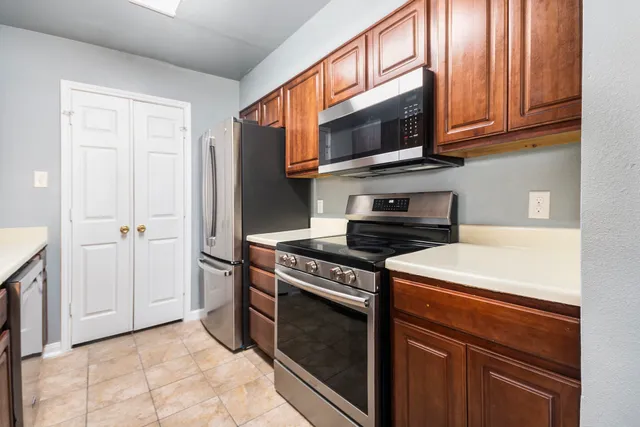 a kitchen with a stove and a microwave