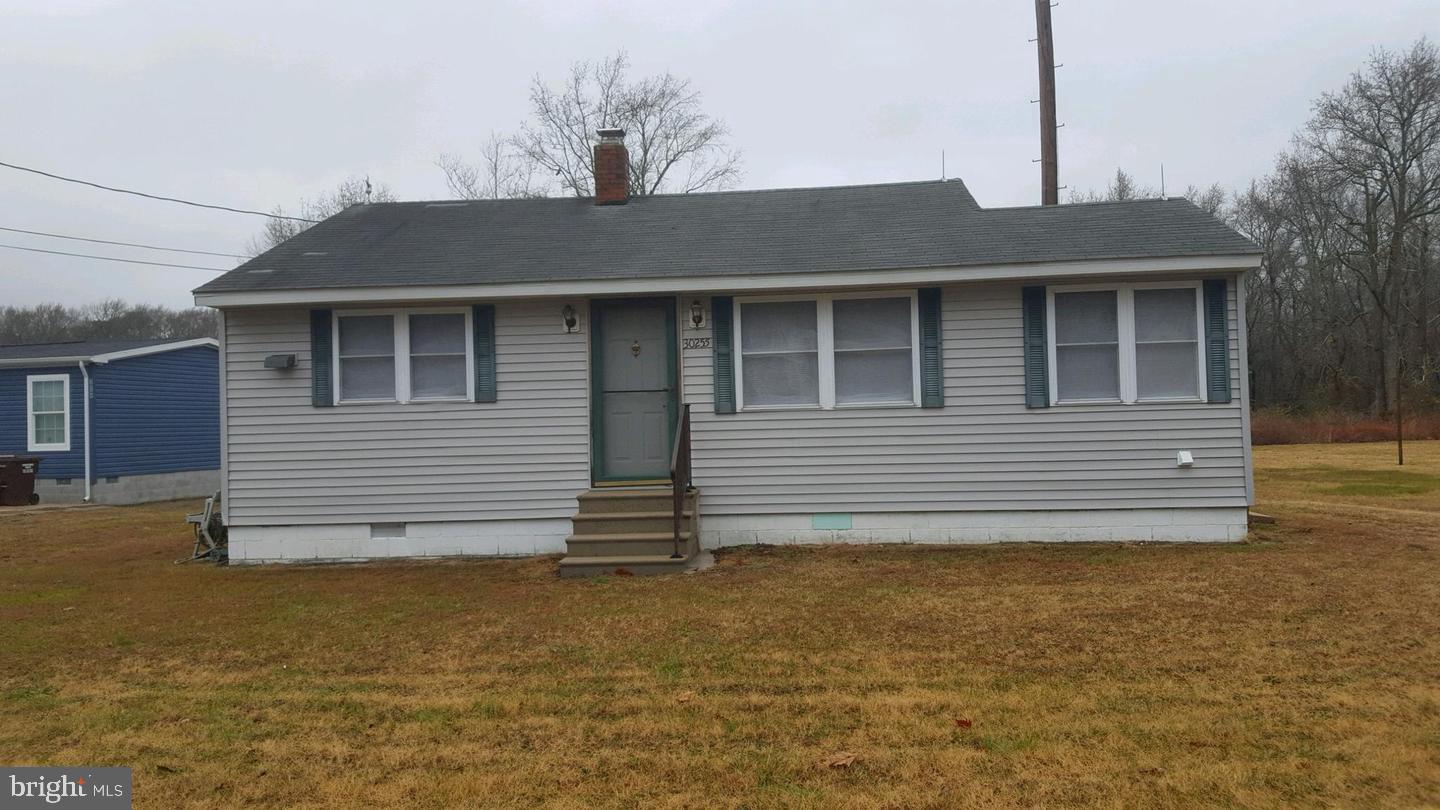 30225 Frankford School Road Frankford, DE 19945 - Photo 1 of 10 a front view of a house with a yard
