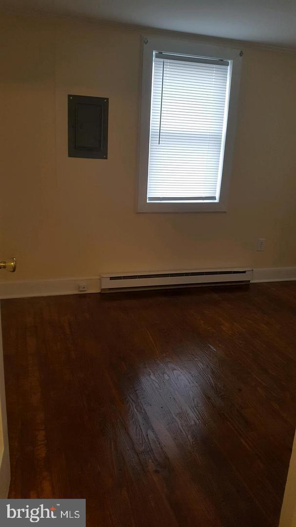 30225 Frankford School Road Frankford, DE 19945 - Photo 10 of 10 an empty room with wooden floor and windows