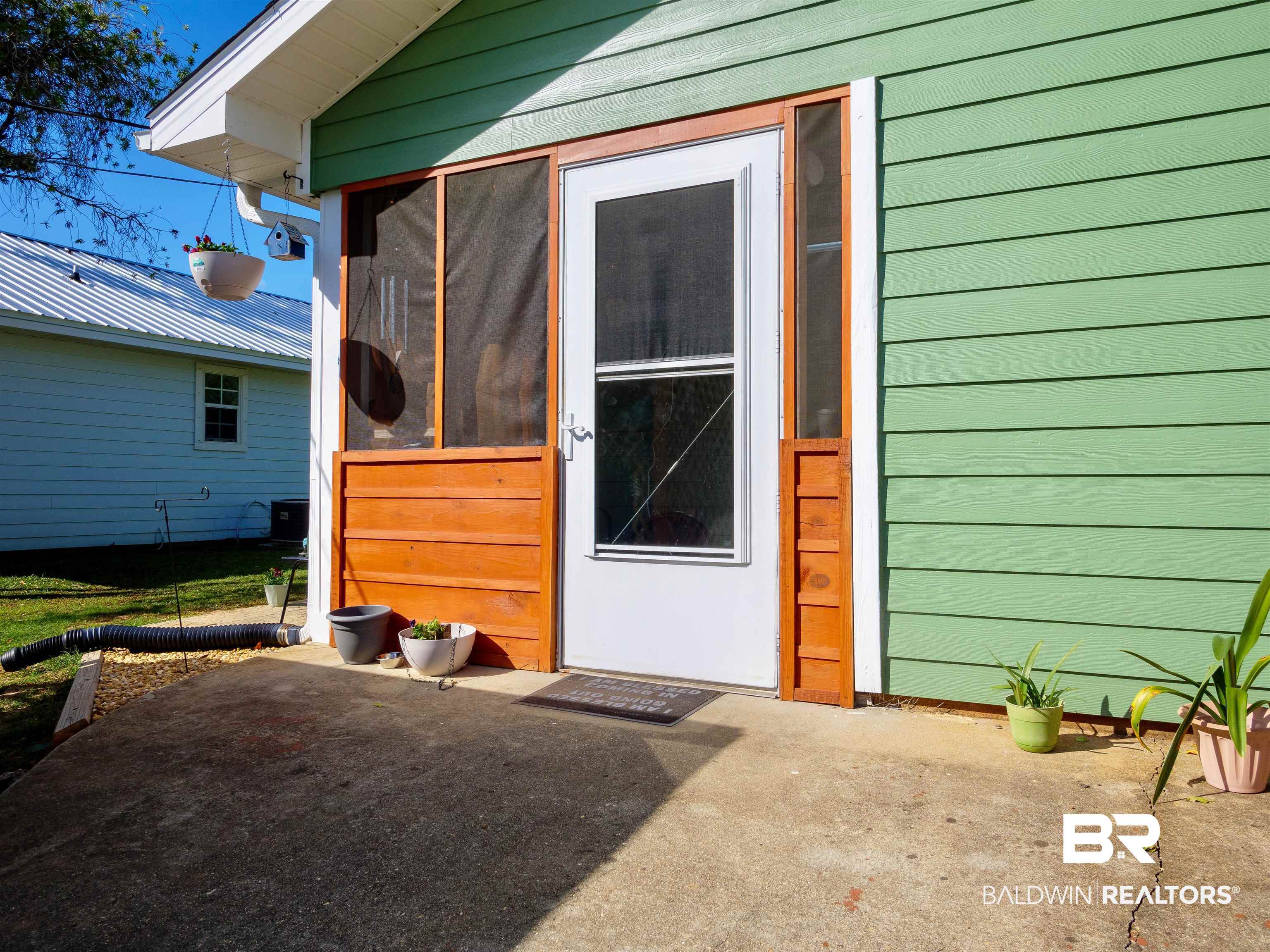 709 West Marigold Avenue Foley, AL 36535 - Photo 18 of 26 Screened in quaint back porch