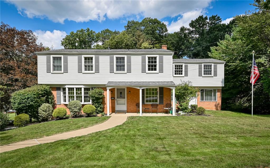 121 Oakglen Road Pittsburgh, PA 15237 - Photo 1 of 30 a front view of a house with garden