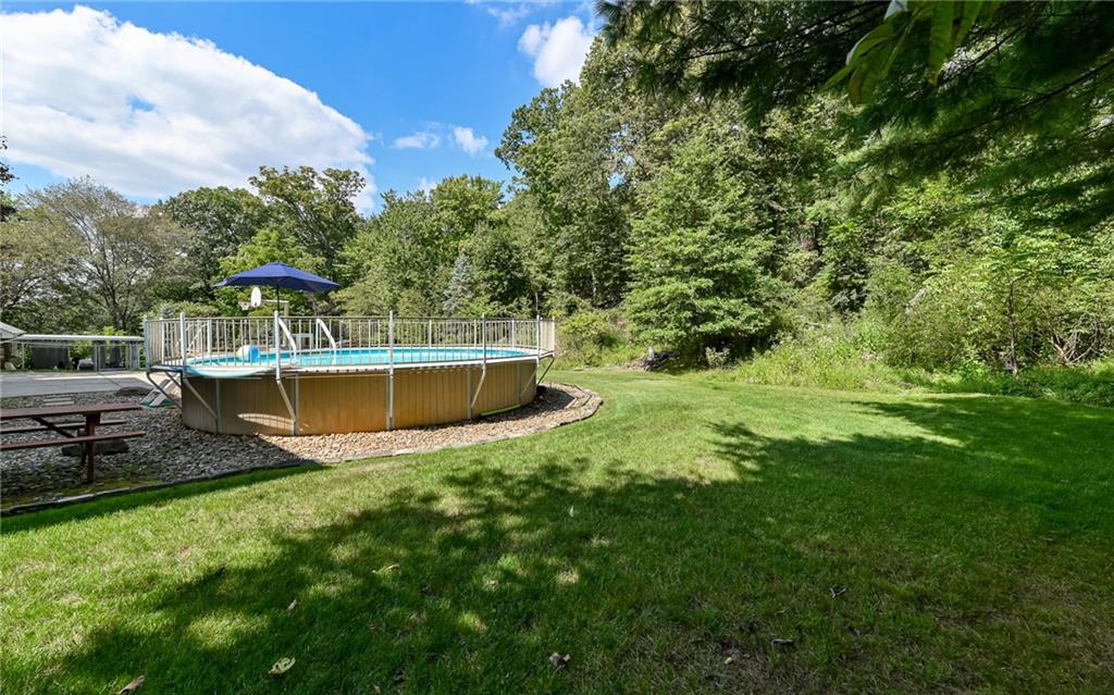 121 Oakglen Road Pittsburgh, PA 15237 - Photo 29 of 30 a view of a swimming pool with a yard